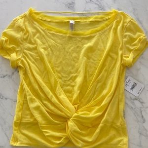 Beautiful yellow free people movement crop with knot detail, XS.